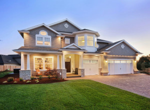 single family home lit up at dusk