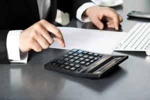 man using black calculator