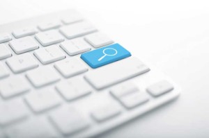 magnifying glass blue key keyboard search